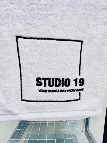 a towel with the studio logo on it at Studio 19 Diamond-2bedroom apartment in Gaborone