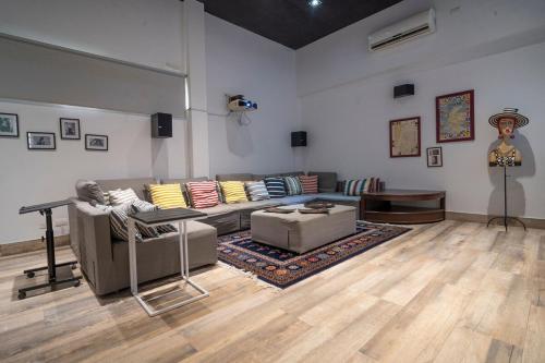 a living room with two couches and a table at wonderful house in Marina Baru in Cartagena! in Isla Barú