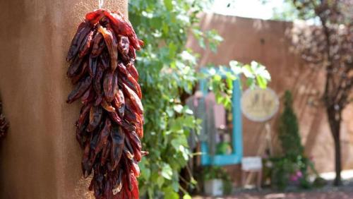 a red scarf hanging on the side of a wall at Courtyard by Marriott Albuquerque Airport in Albuquerque