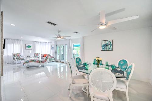 a dining room with a glass table and chairs at Waterfront Marco Island House with Shared Dock! in Marco Island