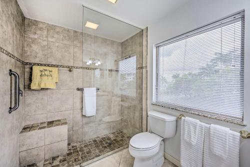 a bathroom with a toilet and a shower at Waterfront Marco Island House with Shared Dock! in Marco Island