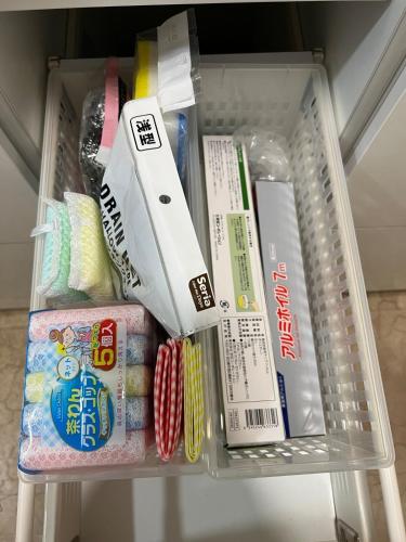 a drawer filled with food and other food items at Mountain Gate FURANO in Kami-furano