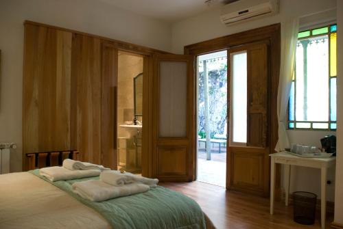 A bed or beds in a room at Cruce´s Hotel Boutique