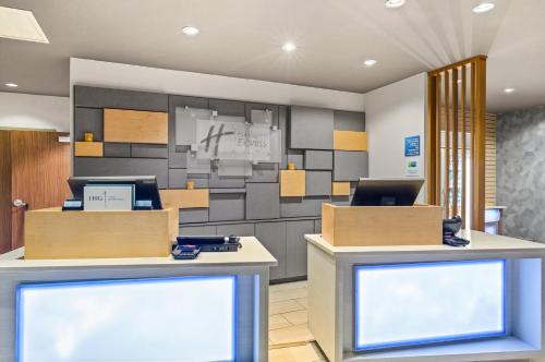 an office with a lobby with a reception desk at Holiday Inn Express & Suites - Carrollton West by IHG in Carrollton