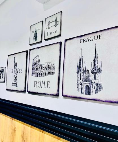 a group of drawings on a wall at Studio 19 Diamond-2bedroom apartment in Gaborone