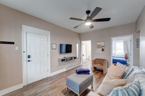 a living room with a couch and a ceiling fan at Prime 2BR Gem, Near Convention Hub! in Indianapolis