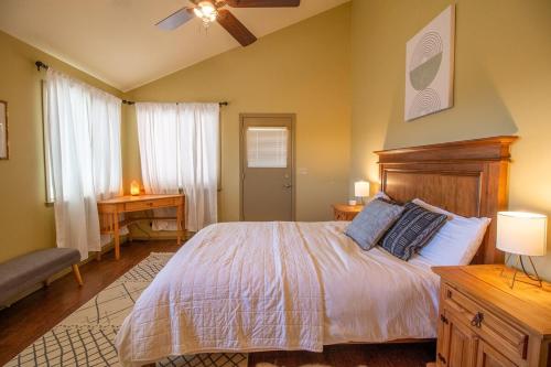 a bedroom with a large bed and a table at The Hive Vista at Castoro Cellars in Templeton