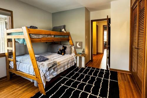 a bedroom with a bunk bed with a teddy bear sitting on it at MI CASA- 4 Bd- Mega Playground in Willmar
