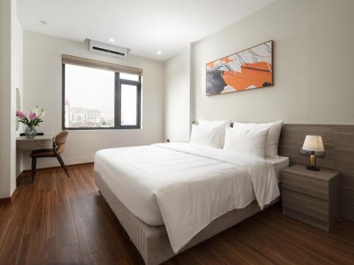 Ένα ή περισσότερα κρεβάτια σε δωμάτιο στο Dresidence Hotel Ninh Binh
