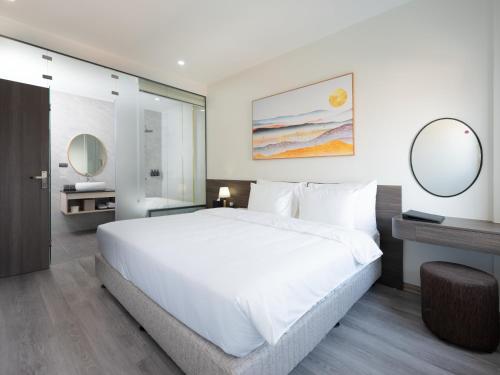 Ένα ή περισσότερα κρεβάτια σε δωμάτιο στο Dresidence Hotel Ninh Binh