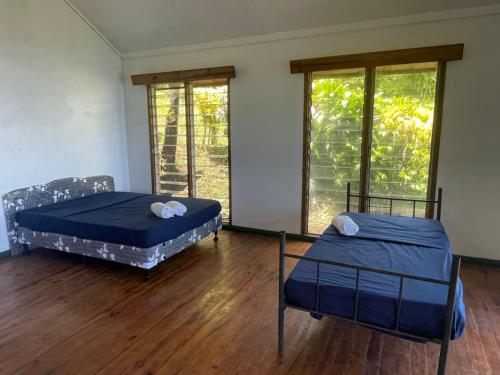 Postel nebo postele na pokoji v ubytování Discover Taveuni Retreats
