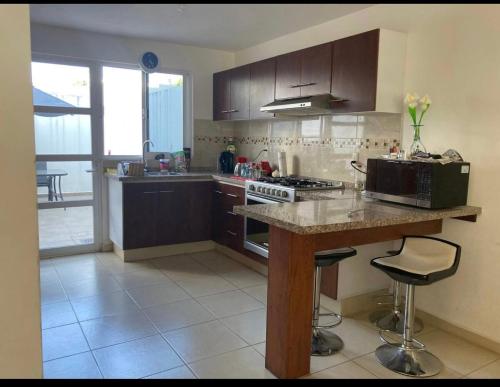 Η κουζίνα ή μικρή κουζίνα στο Casa en bosques de San Juan
