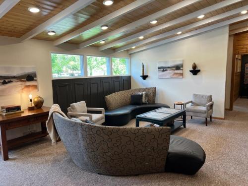 a living room with a couch and chairs at MY PLACE! Luxury 2 Bed with piano! in Willmar