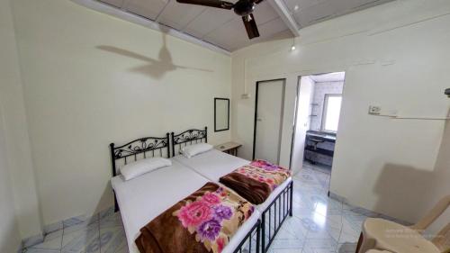 Postel nebo postele na pokoji v ubytování Sameena Guest House