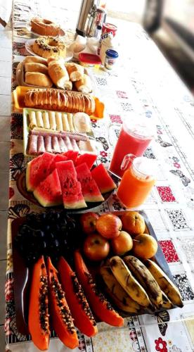 a table with three plates of food on it at Pousada Lunar in Parnaíba