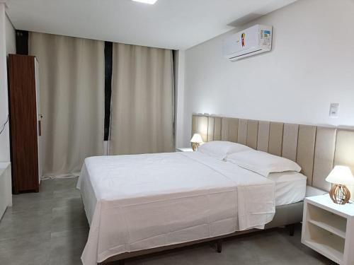 Postel nebo postele na pokoji v ubytování Apartamento Pé na Areia - Ótima Localização - Conforto à beira-mar