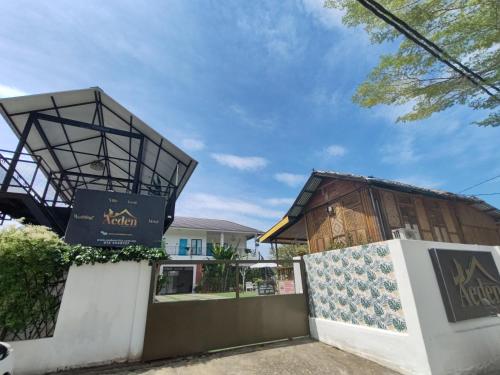 a building with a sign on the side of it at Aeden Villa Roomstay & Homestay in Kuala Kangsar