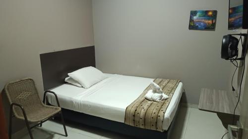 TV a/nebo společenská místnost v ubytování Hotel Simón Plaza