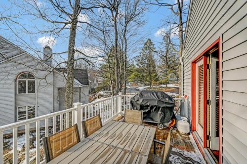 a deck with two chairs on a house at Poconos Paradise Lakeskihikewater Parkkids in Lake Harmony