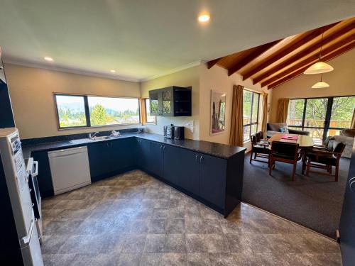 a kitchen with a counter top and a dining room at 5 Alpine Avenue in Hanmer Springs