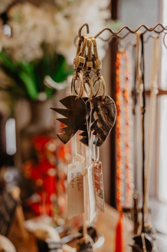 a group of keys hanging from a metal rack at La Bastide de Caro in Siem Reap