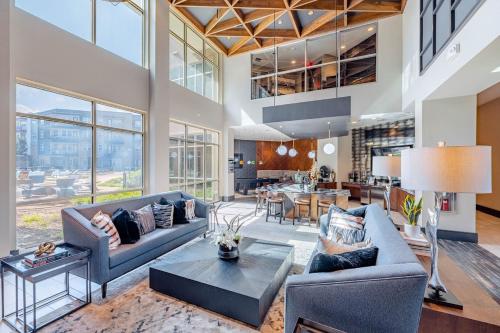a living room with two couches and a table at Cozy 2-bedroom apartment in lovely Austin in Austin