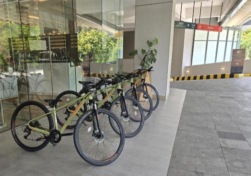 a row of bikes parked in front of a building at DoubleTree by Hilton Jakarta Bintaro Jaya in Serpong