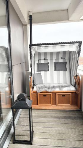 a bedroom with a bed with a canopy at Germania-54 in Böhl