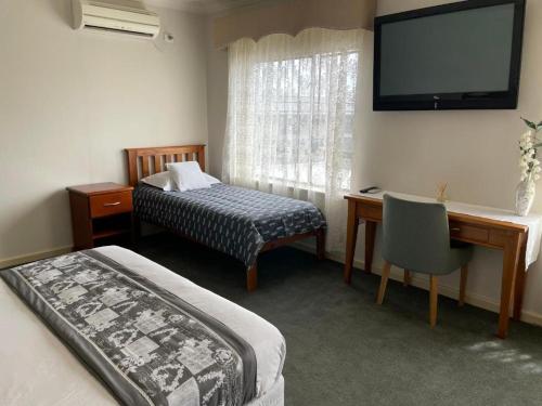 Postel nebo postele na pokoji v ubytování Motel