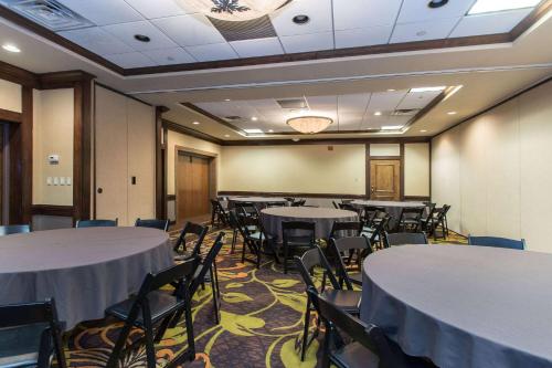 a conference room with tables and chairs in it at Wyndham Independence in Independence