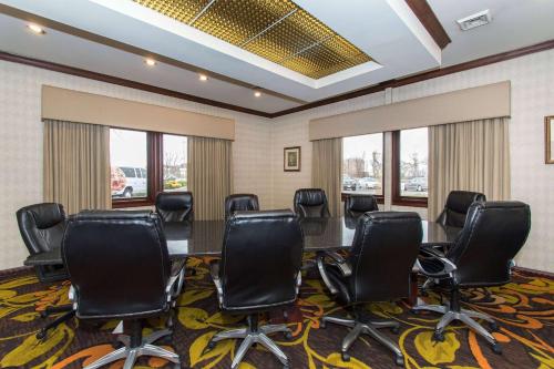 a conference room with a table and chairs at Wyndham Independence in Independence
