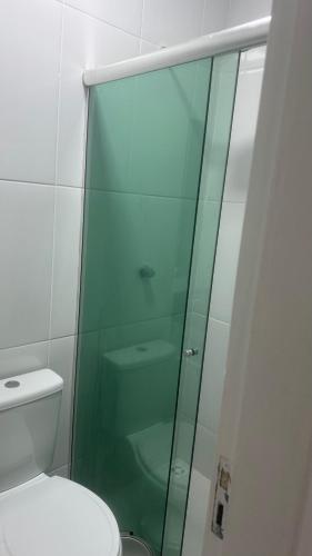 a glass shower in a bathroom with a toilet at Residencial SC in Manaus