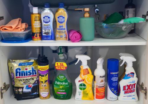 a closet filled with lots of cleaning products at Elite Escape Hawera in Hawera