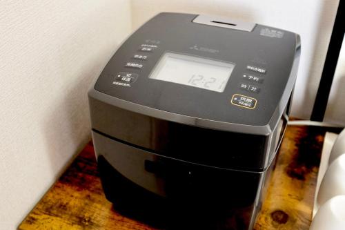 a computer printer sitting on top of a table at たび宿Yumiashi in Sendai