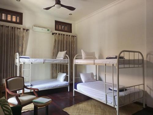 Llit o llits en una habitació de Sojourner House - Dorms
