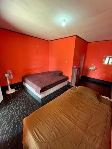 Katil atau katil-katil dalam bilik di Perwita Homestay
