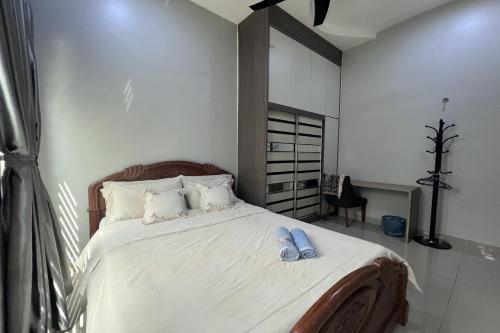 Ένα ή περισσότερα κρεβάτια σε δωμάτιο στο Nurbayu Chalet, Kemaman