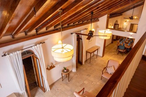 an overhead view of a living room with wooden ceilings at Rosastays Panjim North Goa in Goa