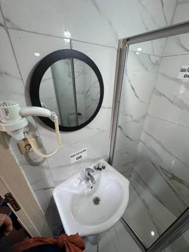a bathroom with a sink and a mirror at Pembe Köşk Old City Center in Istanbul