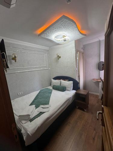 a bedroom with a large bed in a room at Pembe Köşk Old City Center in Istanbul