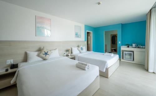 Кровать или кровати в номере HAYA Sea View Hotel Phu Quoc
