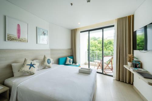Кровать или кровати в номере HAYA Sea View Hotel Phu Quoc
