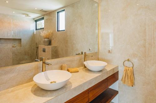 two sinks on a counter in a bathroom at 2BR Ricefield View Villa in Munggu Easy Beach Access in Munggu