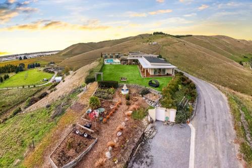 an aerial view of a house on a hill at Cloudy Bay Suite in an 6-bedroom luxury villa in Blenheim