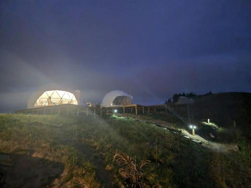 a couple of domes on a hill at night at Oceanview Suite in an 6-bedroom luxury villa in Blenheim