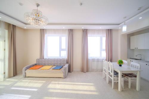 Postel nebo postele na pokoji v ubytování Eagle Town Serviced Apartment