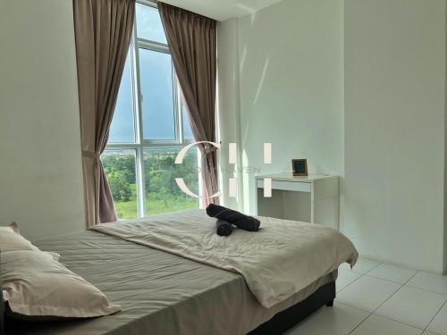 a bed in a room with a large window at TT3 Soho C9-12 at 4 pax Kuching in Kuching