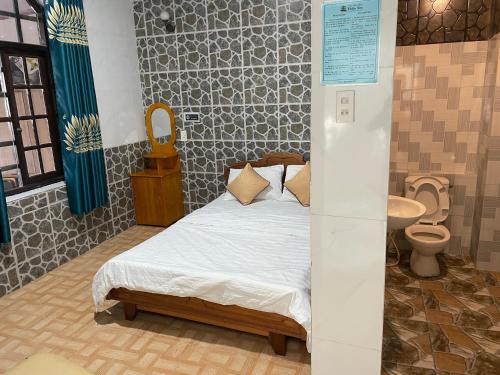 Ένα ή περισσότερα κρεβάτια σε δωμάτιο στο Thien Son Homestay - Giáp Biển