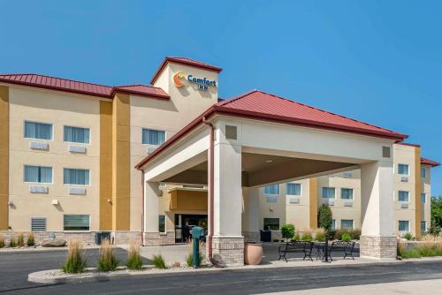 a hotel building with a fire hydrant in front of it at Comfort Inn in Crawfordsville