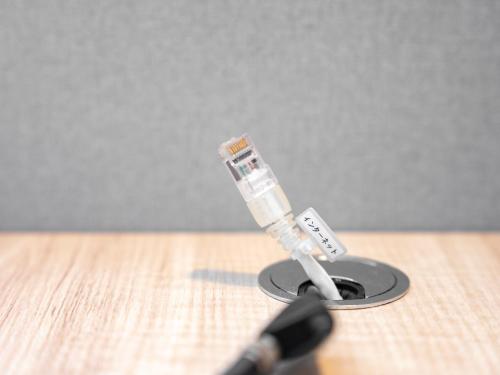 a syringe sticking out of a hole in a microphone at Super Hotel Gotemba Nigo-Kan in Gotemba